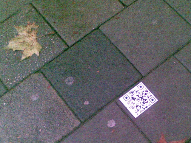 Picture of a QR code sticker near Breda Central Station